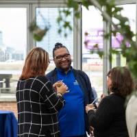 Robert Shorty chatting with two other colleagues